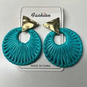 Teal rattan earrings with gold accent. NBW